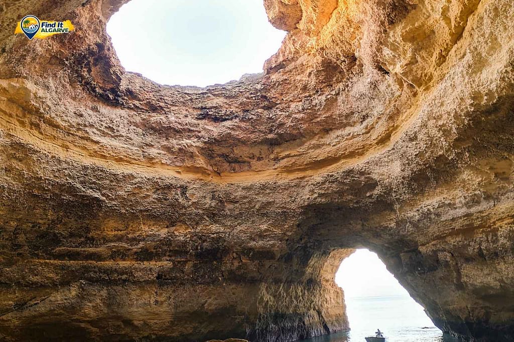 Boat tour inside the famous Benagil sea cave along the Algarve coastline in Portugal